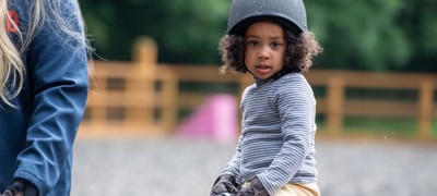 child on a pony summerfield stables