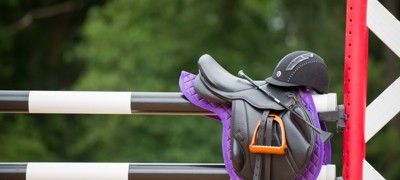 saddle on fence