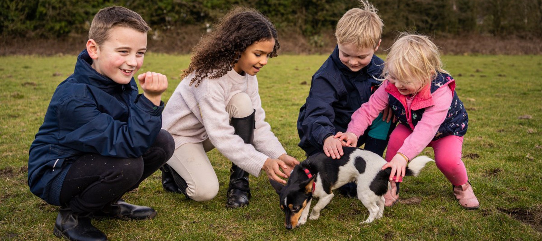 children playing with dog BHS Parbold Equestrian Centre
