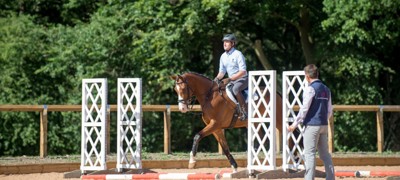 Coach and rider on a horse 