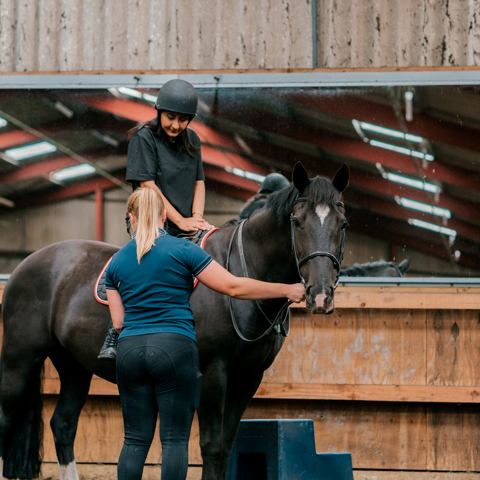 Coach And Rider At The Start Of A Lesson