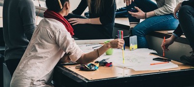 people discussing around a desk