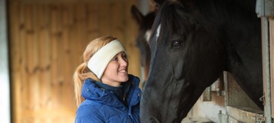 woman and black horse 