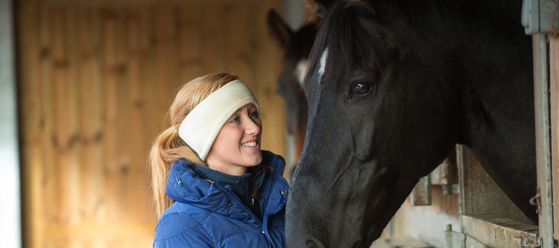 woman and black horse 