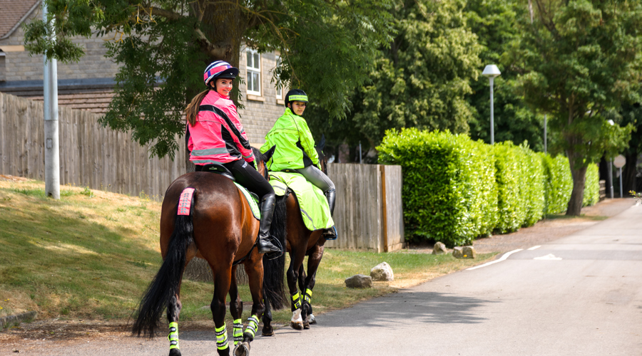 Horses And Riders In Hi Vis Hacking On The Road (1)