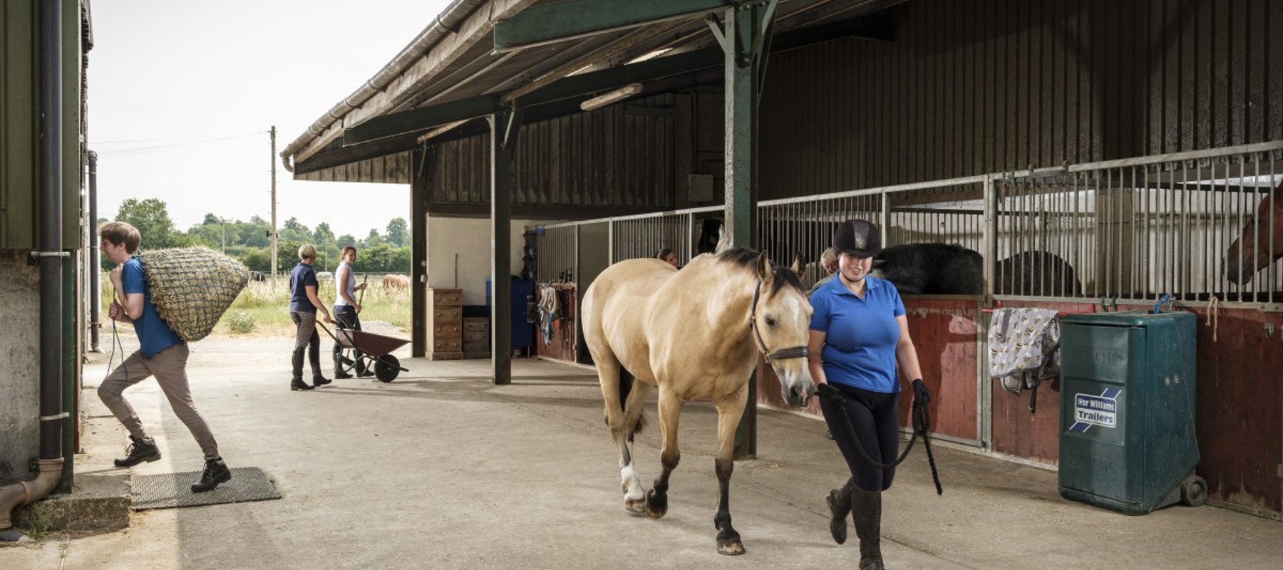 woman leading a horse in hand