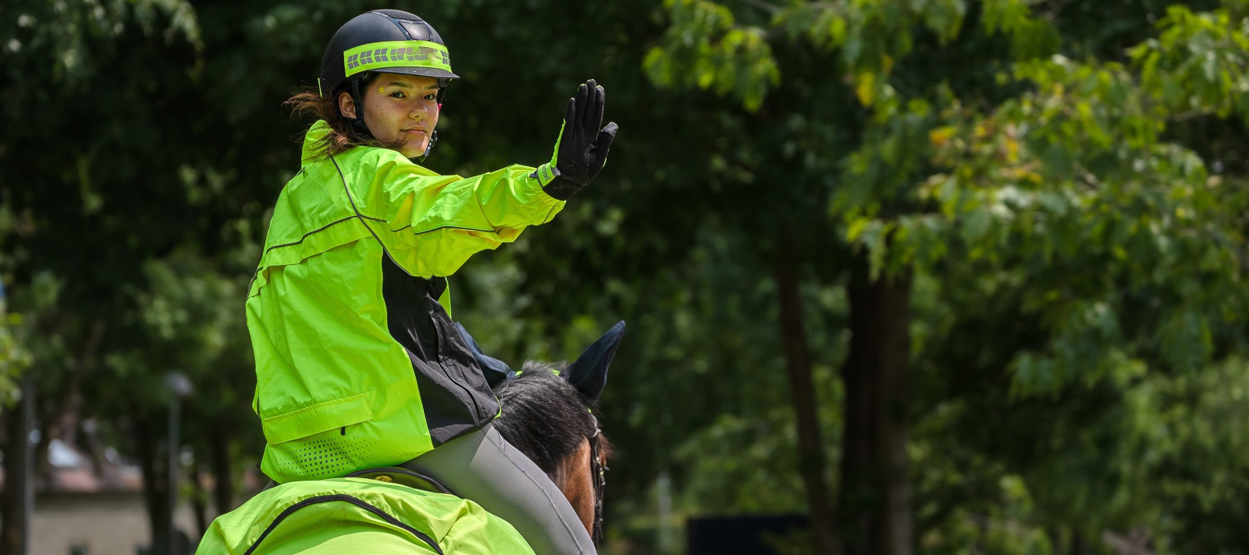 Rider In Hi Vis Signalling Stop