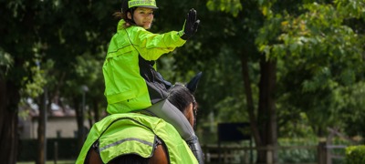 Rider In Hi Vis Signalling Stop