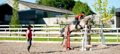 Rider on a horse vertical jump 