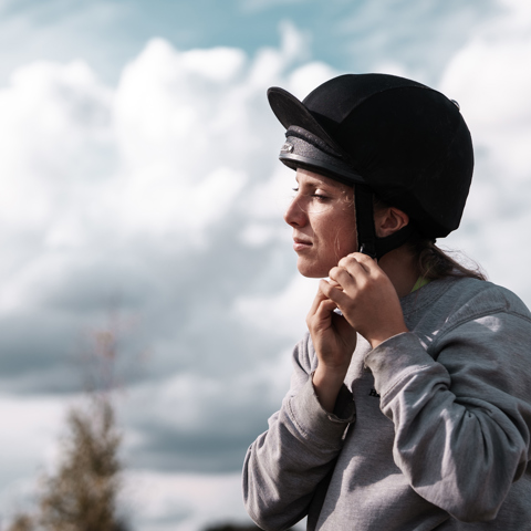 Hemps Green Sept 24 Woman Putting On Riding Hat