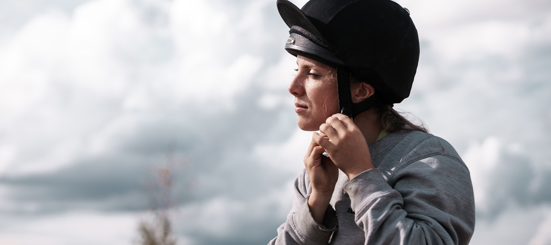 Hemps Green Sept 24 Woman Putting On Riding Hat