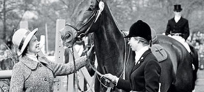 Queen Elizabeth II near a horse