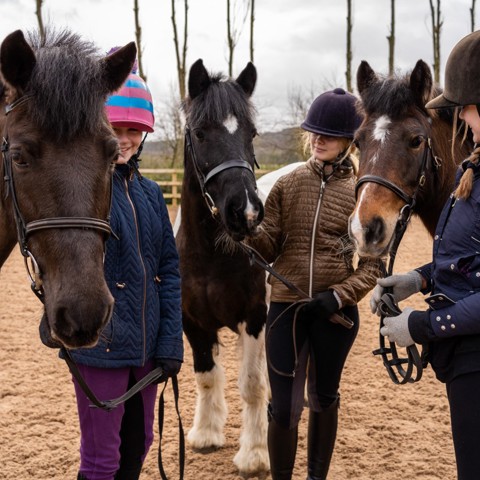 horse riders smiling near ponies parbold equestrian centre