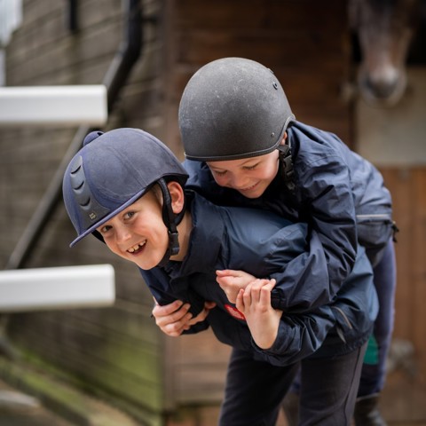 smiling children wearing helmet