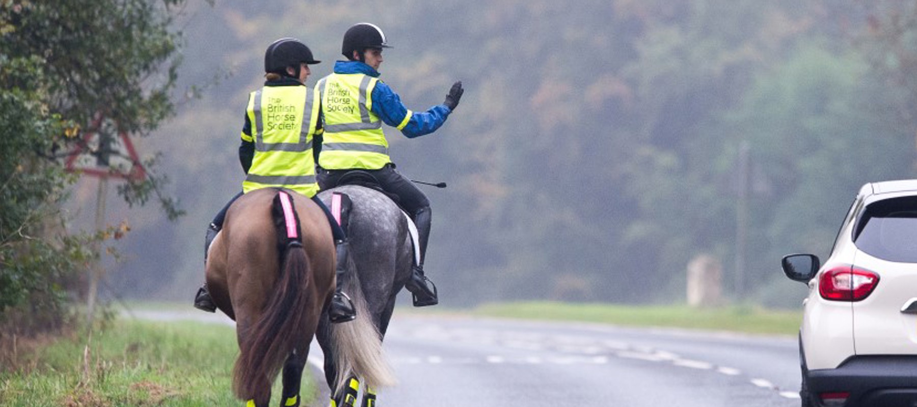 Access Car Passing Riders Slowly