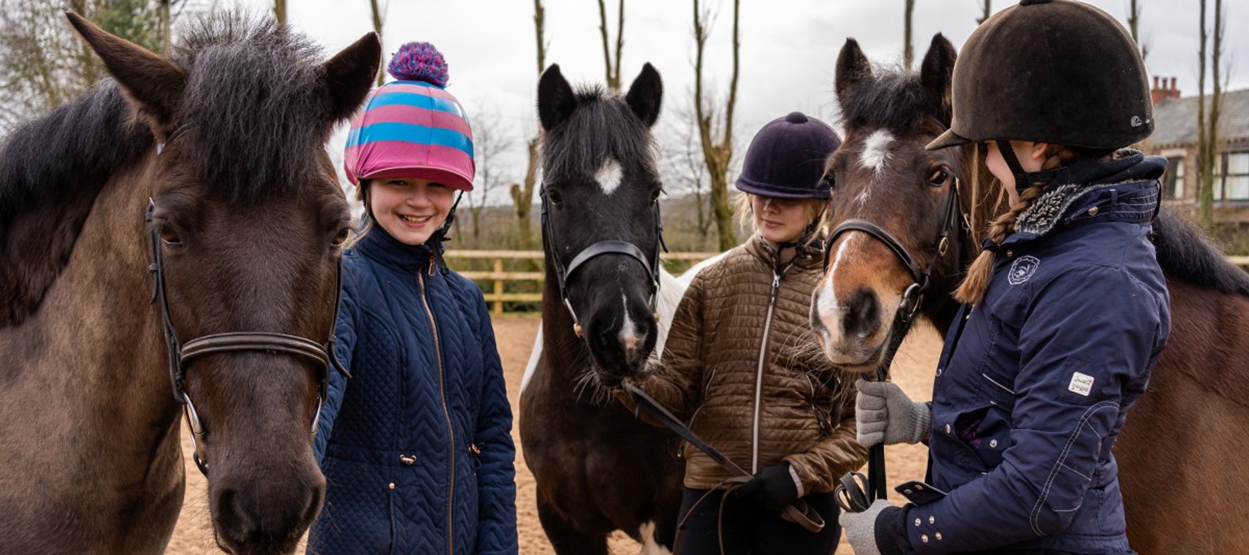 horse riders smiling near ponies parbold equestrian centre
