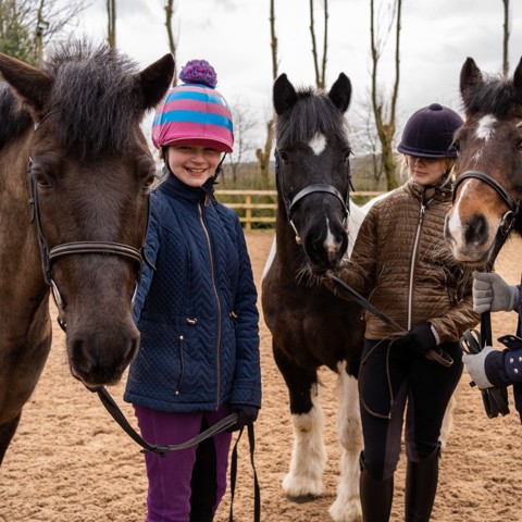 horse riders smiling near ponies parbold equestrian centre