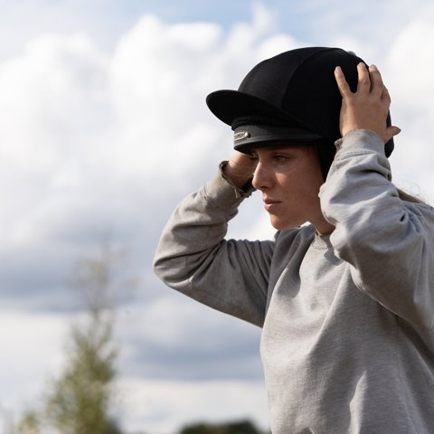 Hemps Green Sept 24 Woman Putting On Riding Hat