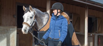 rider and her horse walking
