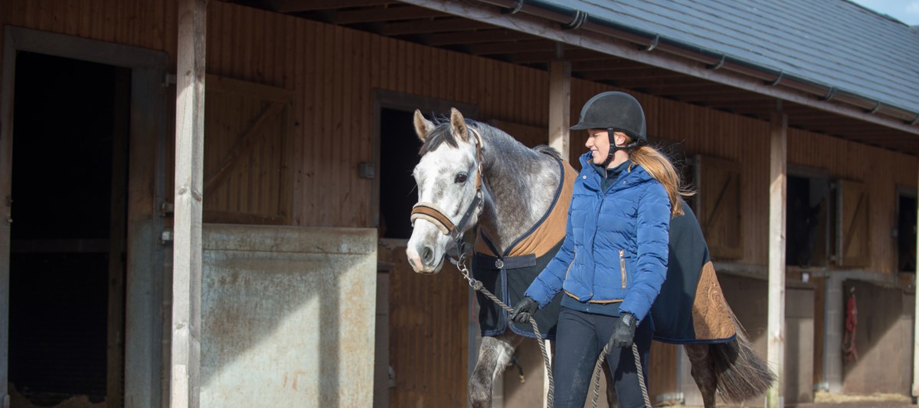 rider and her horse walking